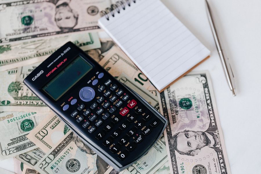 Calculator and cash for budgeting